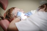 child open mouthed at dentist