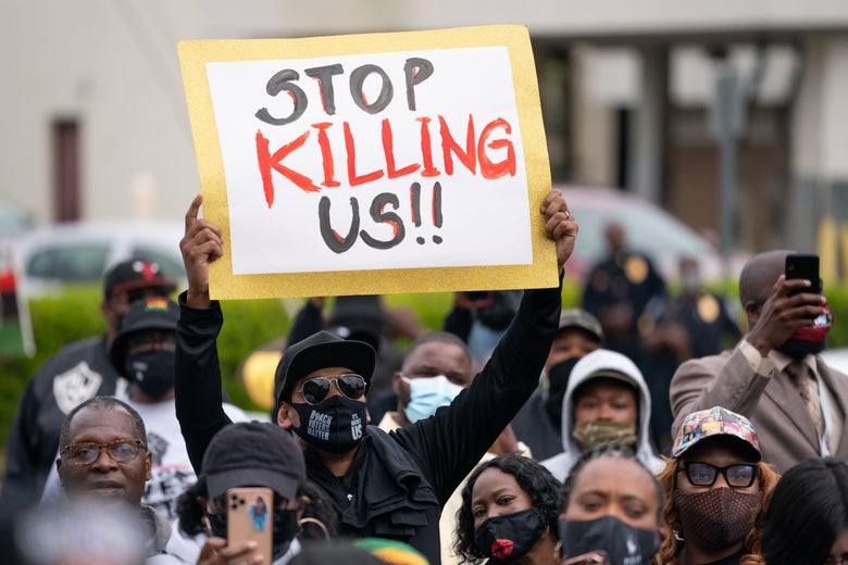 Demonstrators gather outside a government building during an emergency city council meeting April 23, 2021 in Elizabeth City, North Carolina.