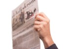 hand holding newspaper