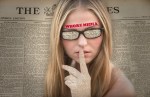woman with glasses and 'whore media' written on her forehead