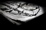 spectacles on folded newspaper