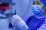 nurse with covid 19 injection