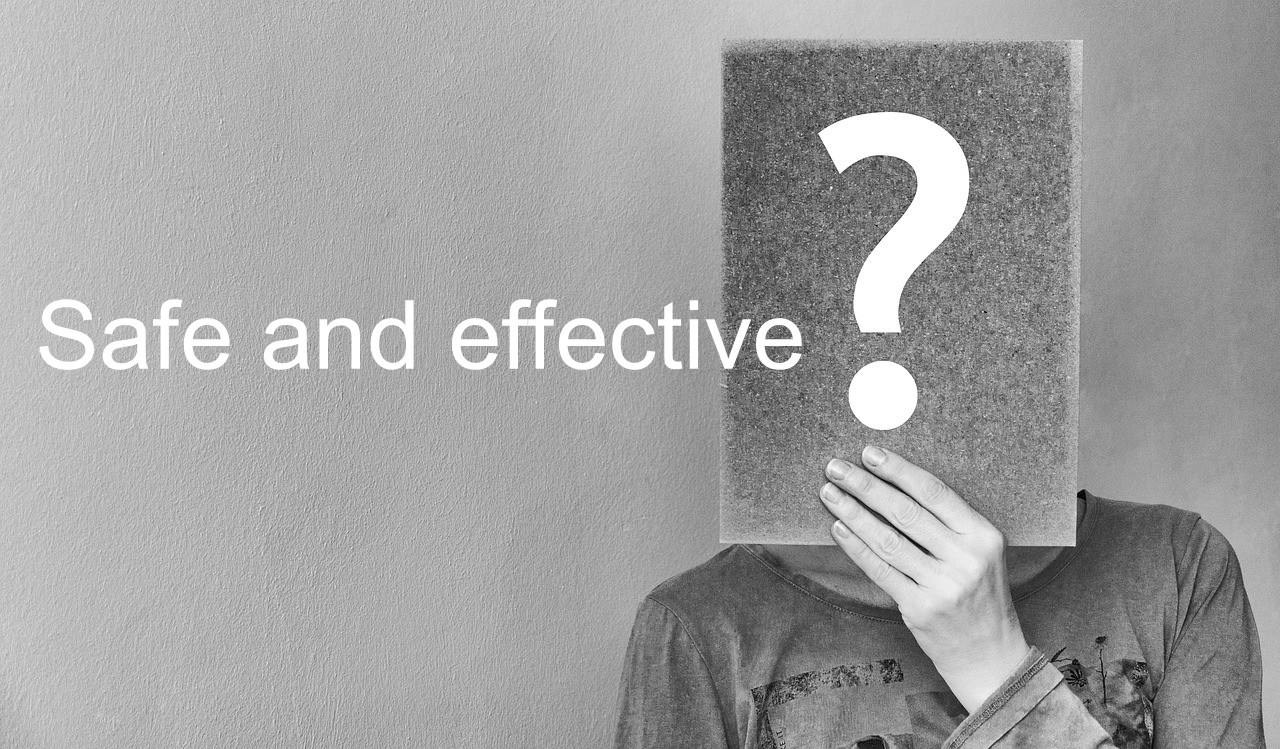 hand holding sign with question mark