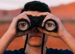 person with binoculars featuring the eyes