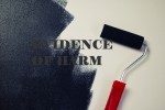 paint roller covering 'evidence of harm' with black paint