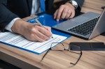 lawyer at desk with laptop