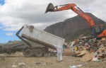 trailer and digger at landfill rubbish dump Image by Heamna Manzur from Pixabay