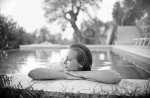 woman relaxing in swimming pool