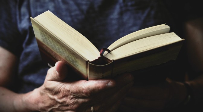 holding a book