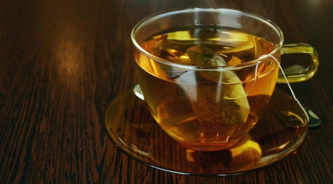 cup of rea with bag