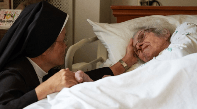 elderly woman with a Catholic Nun - euthanasia
